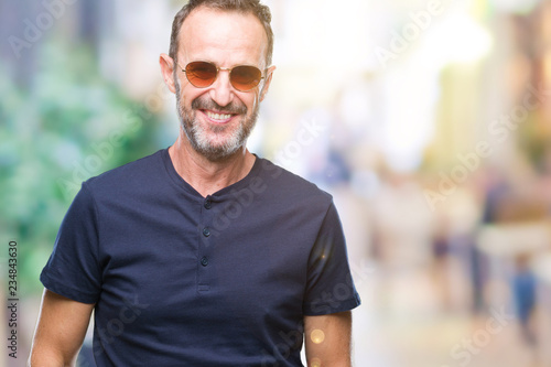 Middle age hoary senior man wearing sunglasses over isolated background with a happy and cool smile on face. Lucky person.