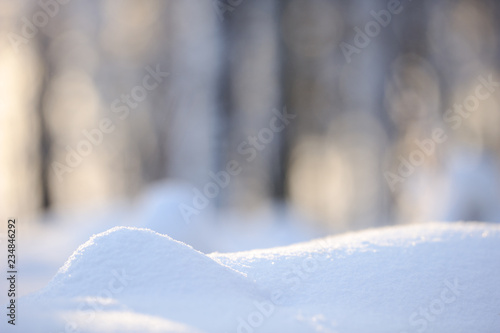 Close-up of soft newly fallen snow. Selective focus and shallow depth of field.