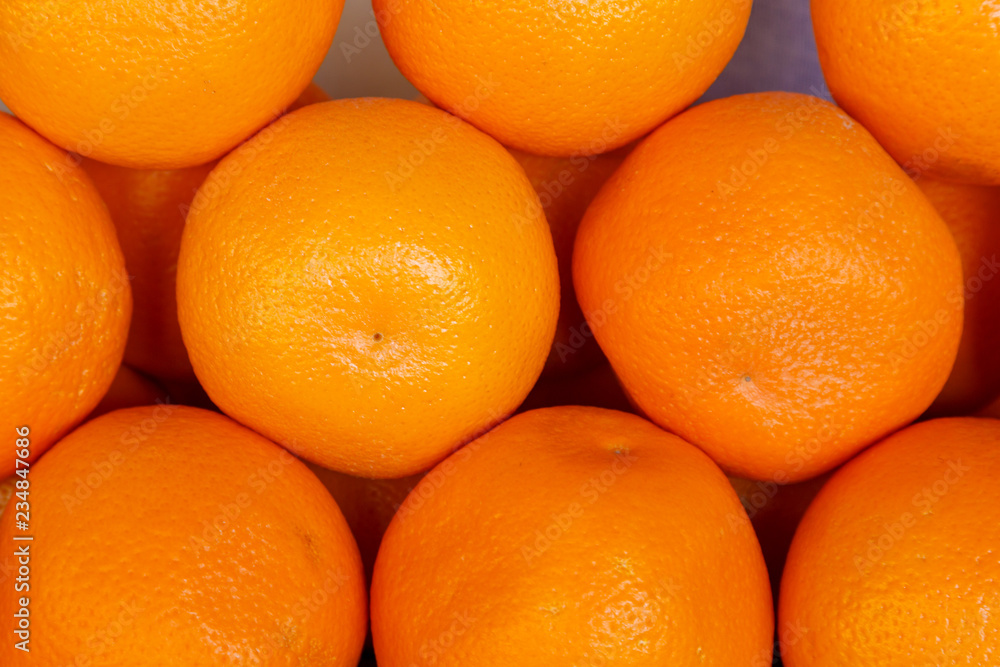 Fresh oranges on the market, view from above. Background, pattern. Fresh oranges on the market, view from above. Background, pattern.