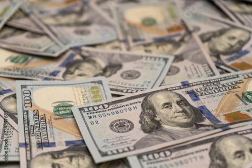 Close-up of scattered hundred dollar bills