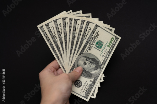 Hand holding money photo