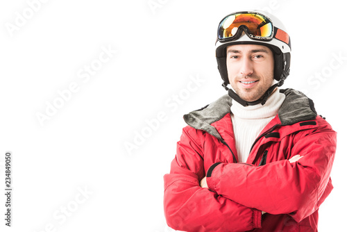 adult man in red ski jacket, goggles and helmet with arms crossed smiling and looking at camera isolated on white © LIGHTFIELD STUDIOS