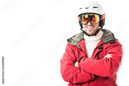 Handsome man in snowsuit smiling and looking at camera isolated on white