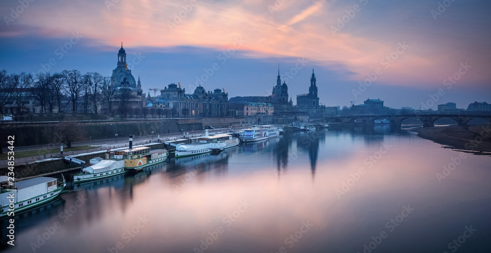 Dresden. Panoramic image of Dresden, Germany during sunset with Elbe River in the foreground.