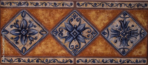 Detail of the traditional tiles from facade of old house. Decorative tiles.Valencian traditional tiles. Floral ornament.