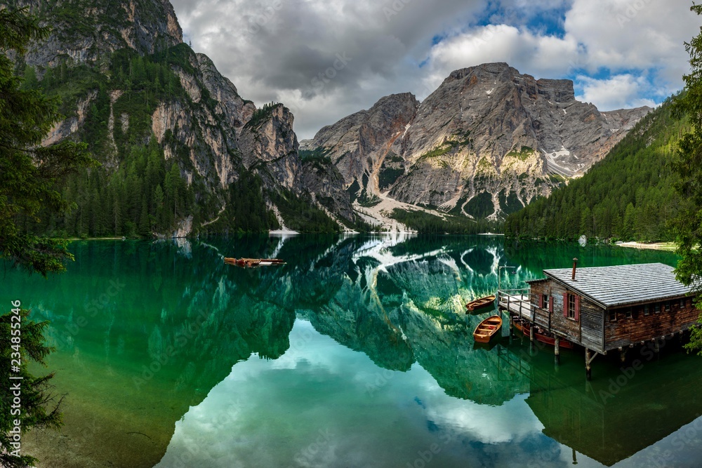Lake Prags reflecting mountains, Dolomites, Italy Lake Prags reflecting mountains, Dolomites, Italy