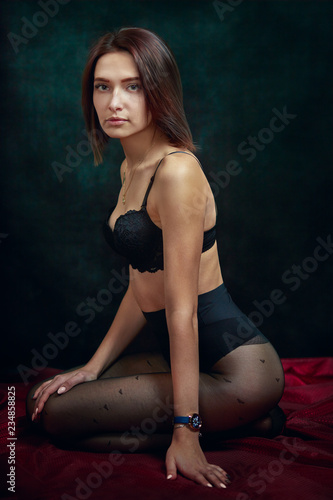 Young beautiful girl in underwear and pantyhose