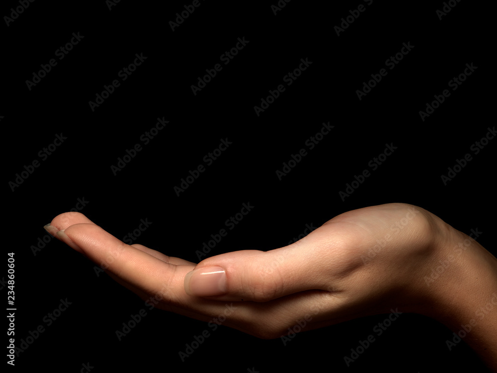 female hand facing up on black background female hand facing up on black background
