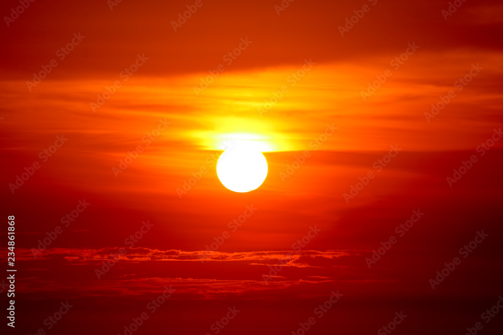 last light of sunset on the red cloud orange sky and ray around sun last light of sunset on the red cloud orange sky and ray around sun