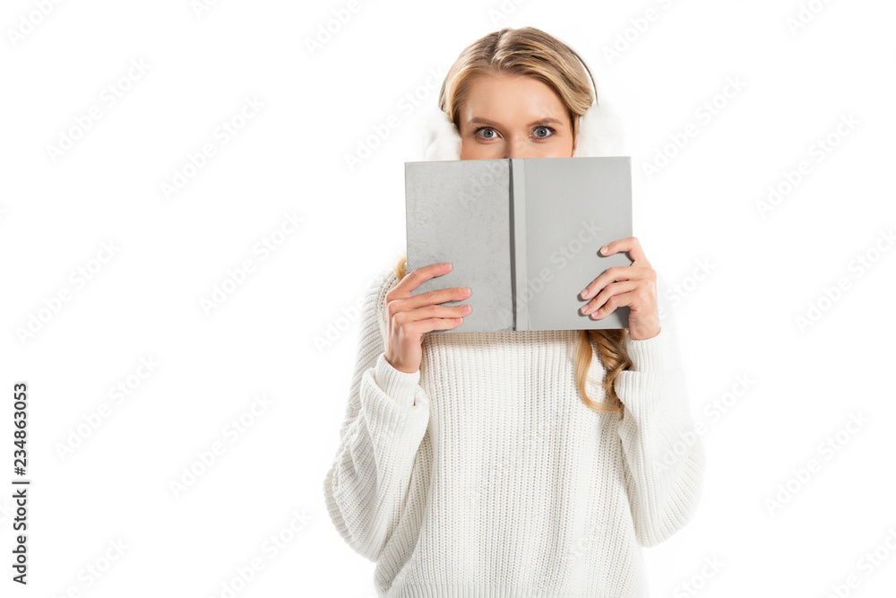 happy girl hiding behind the book isolated on white happy girl hiding behind the book isolated on white