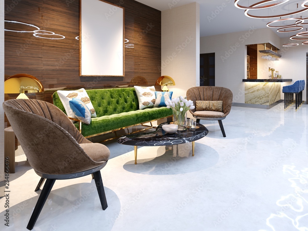 Reception area and lounge area with beautiful colored furniture, a sofa  with two armchairs, metal legs and soft upholstery. The painting on the  wooden wall, decorative flowerpots and a magazine table. Stock