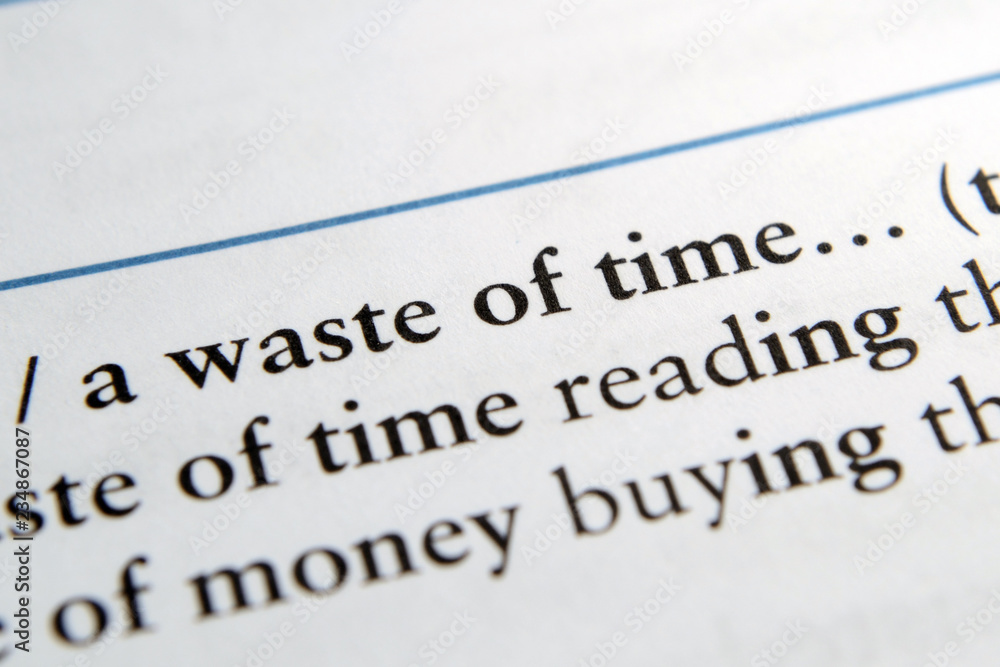 Waste of time phrase in English textbook Selective focus Waste of time phrase in English textbook Selective focus