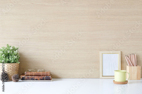 Mockup workspace desk and copy space books,plant and coffee on table