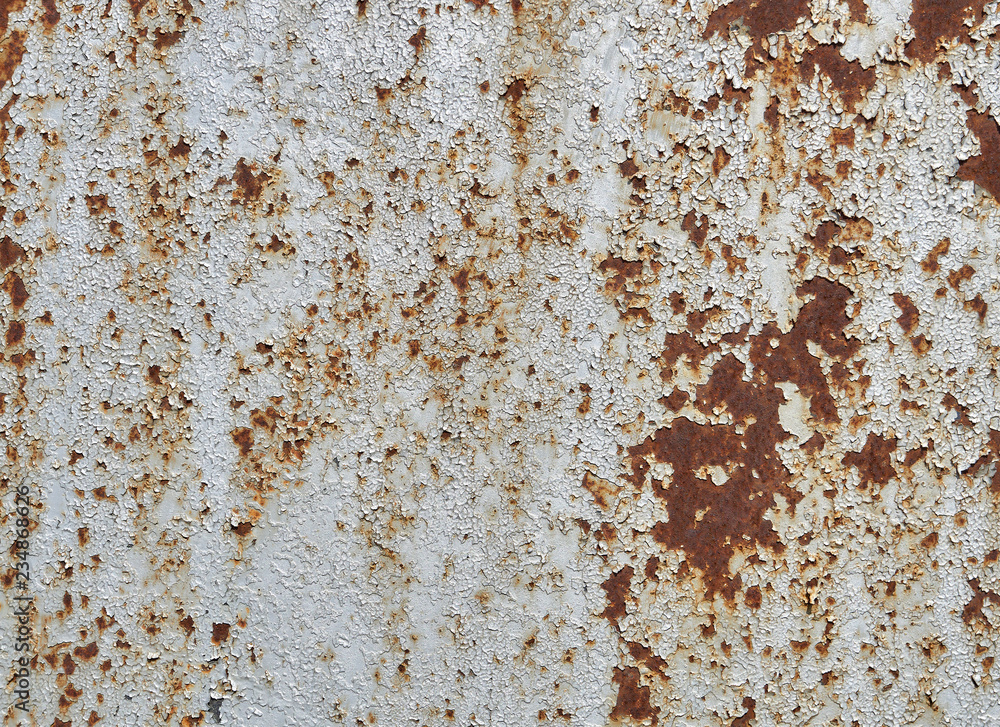 Rusted white painted metal wall. Rusty metal background with streaks of rust. Rust stains. The metal surface rusted spots Rusted white painted metal wall. Rusty metal background with streaks of rust. Rust stains. The metal surface rusted spots