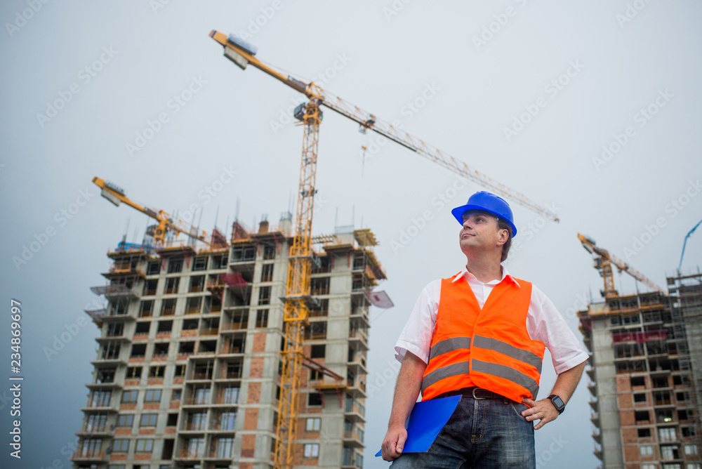 Architect on a construction site during a housing project Architect on a construction site during a housing project