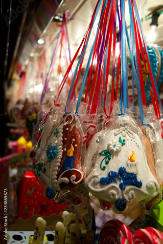 Altenburg / Germany: Colorfully decorated gingerbread bells and other Christmas sweets at a stand on the Christmas Market in the old historical city in Eastern Thuringia