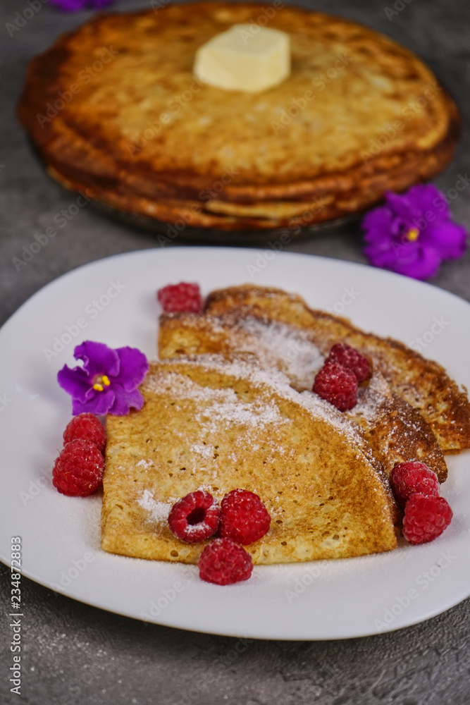 Pancakes with raspberries and powdered sugar Pancakes with raspberries and powdered sugar