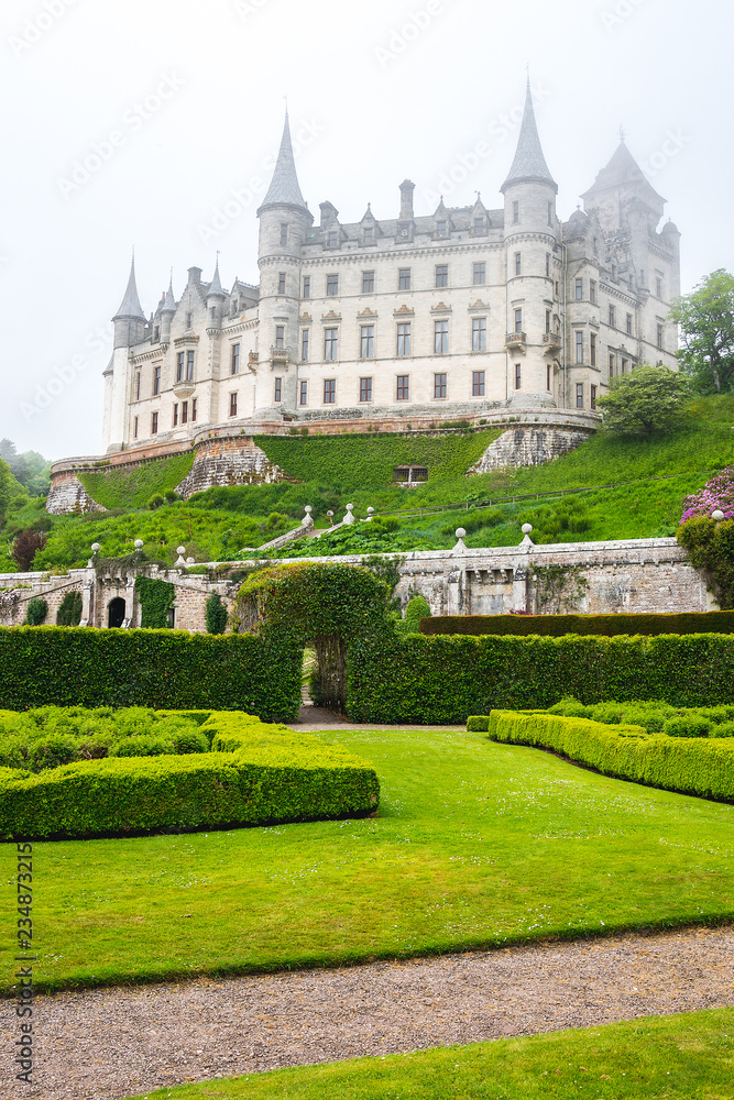 Dunrobin castle among scottish mist, Scotland.