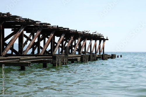 Old wooden pier with metal fences