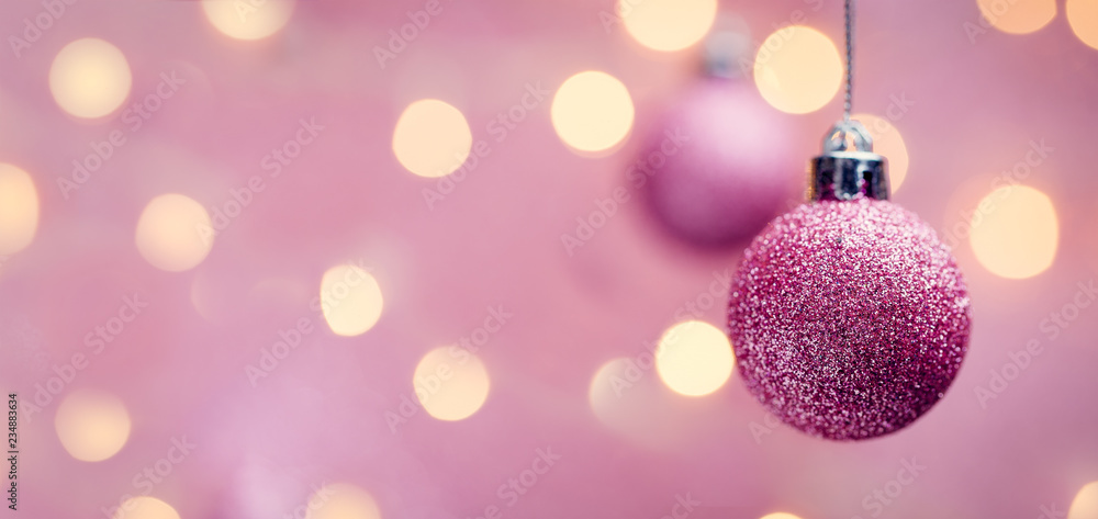 Picture of two New Year's pink balls on pink background with spots. Picture of two New Year's pink balls on pink background with spots.