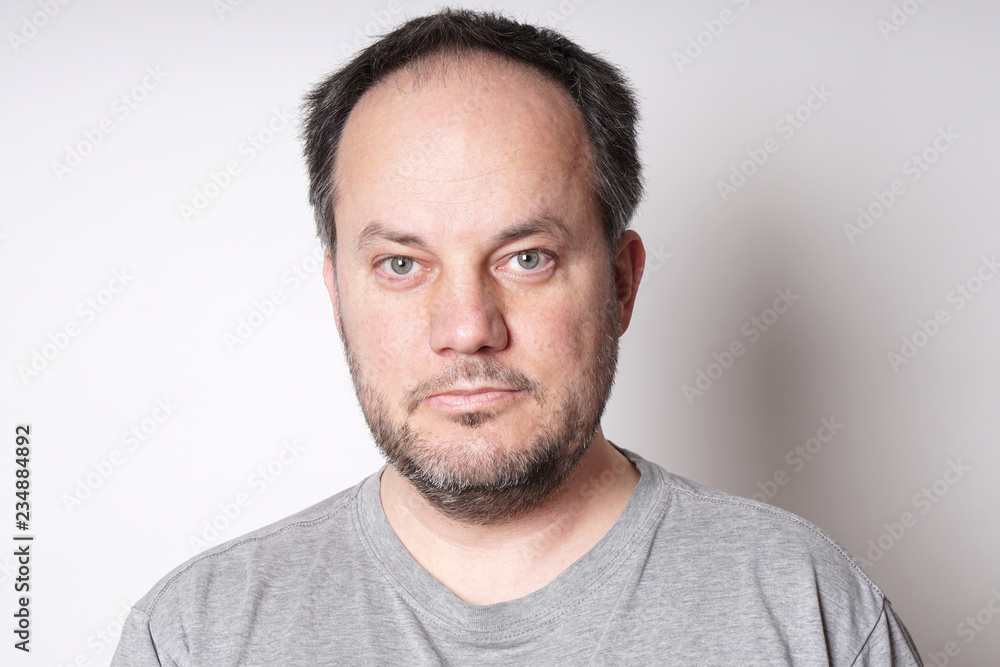 middle aged man with neutral but friendly expression middle aged man with neutral but friendly expression