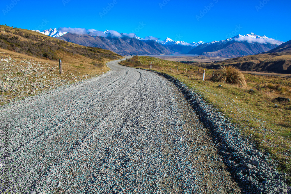 dirt road leading to mountains in Ashburton Lakes District, South Island, New Zealand