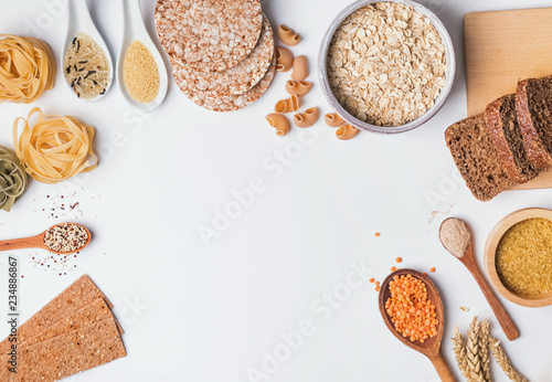 Different types of high carbohydrate food on the white background