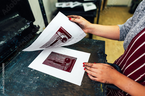 linocut. manual printing on the machine photo