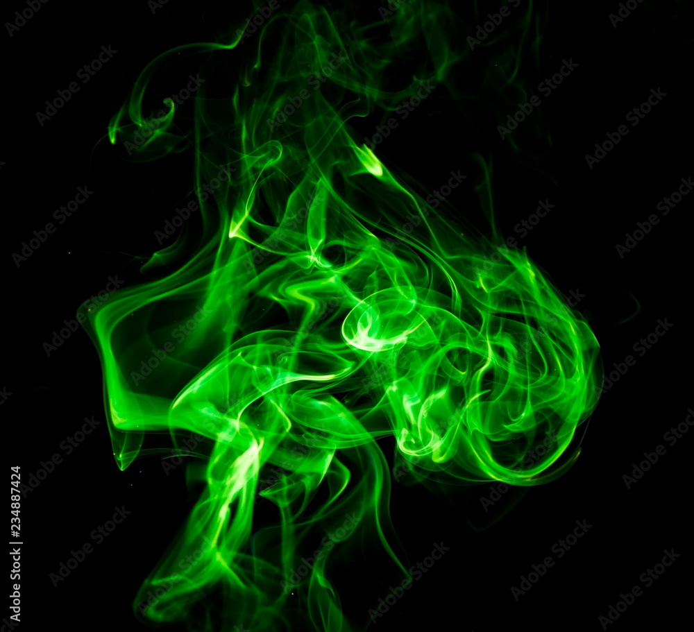 Green smoke on black background Green smoke on black background