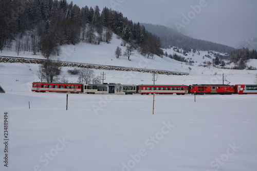 Swiss Train in winter landscape with mountains