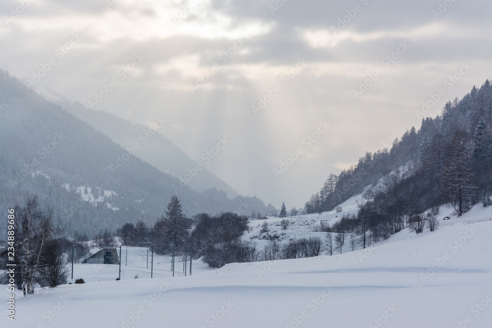 Sunny winter landscape in swiss mountains in the rhone valley