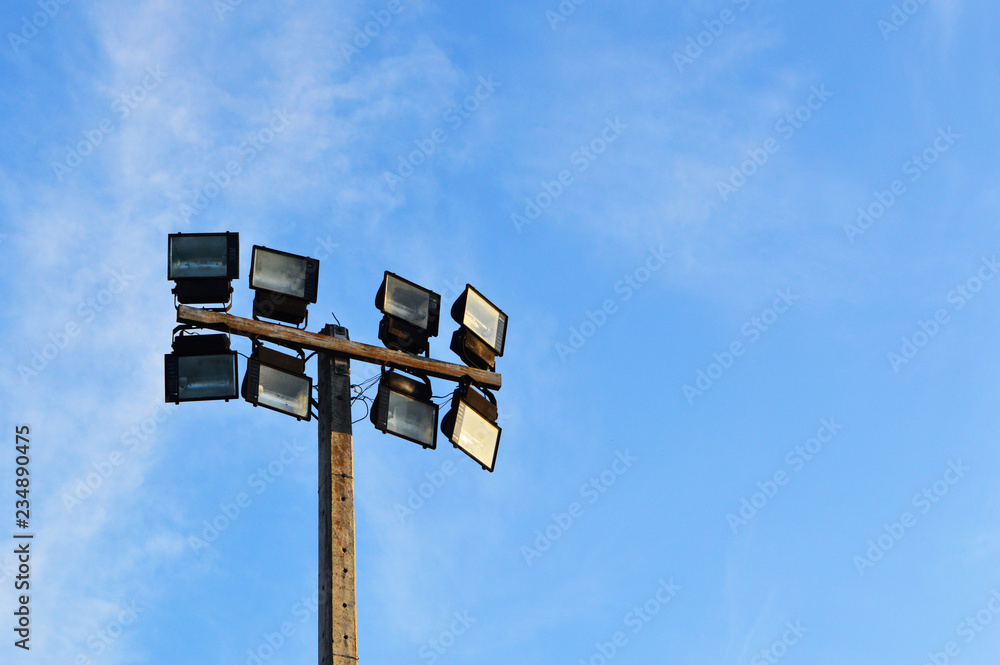 electric pole stadium light and blue sky - stadium spot light tower electric pole stadium light and blue sky - stadium spot light tower