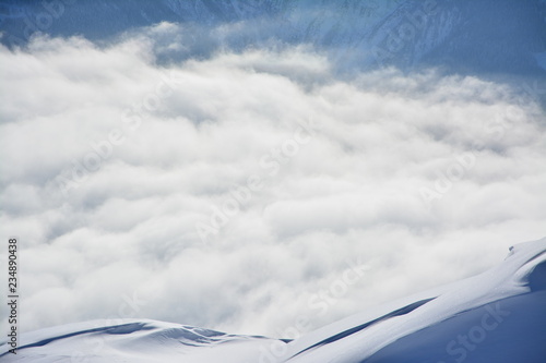Alpine Panaorama in the winter with snow and clouds