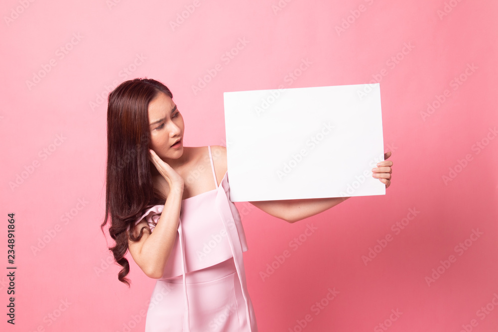 Young Asian woman with white blank sign.