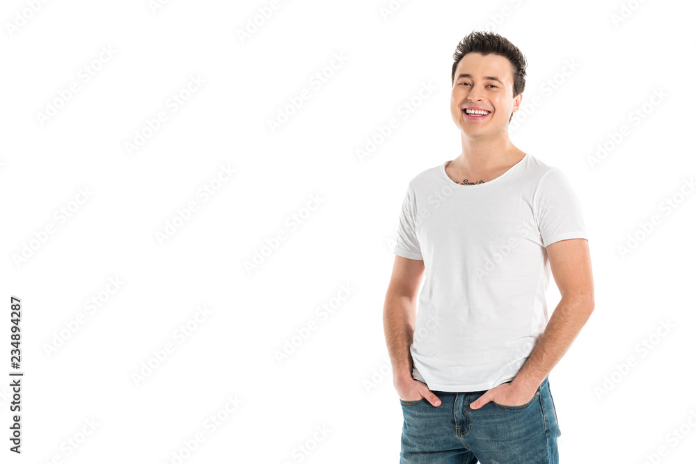 handsome smiling man with hands in pockets looking at camera isolated on white handsome smiling man with hands in pockets looking at camera isolated on white
