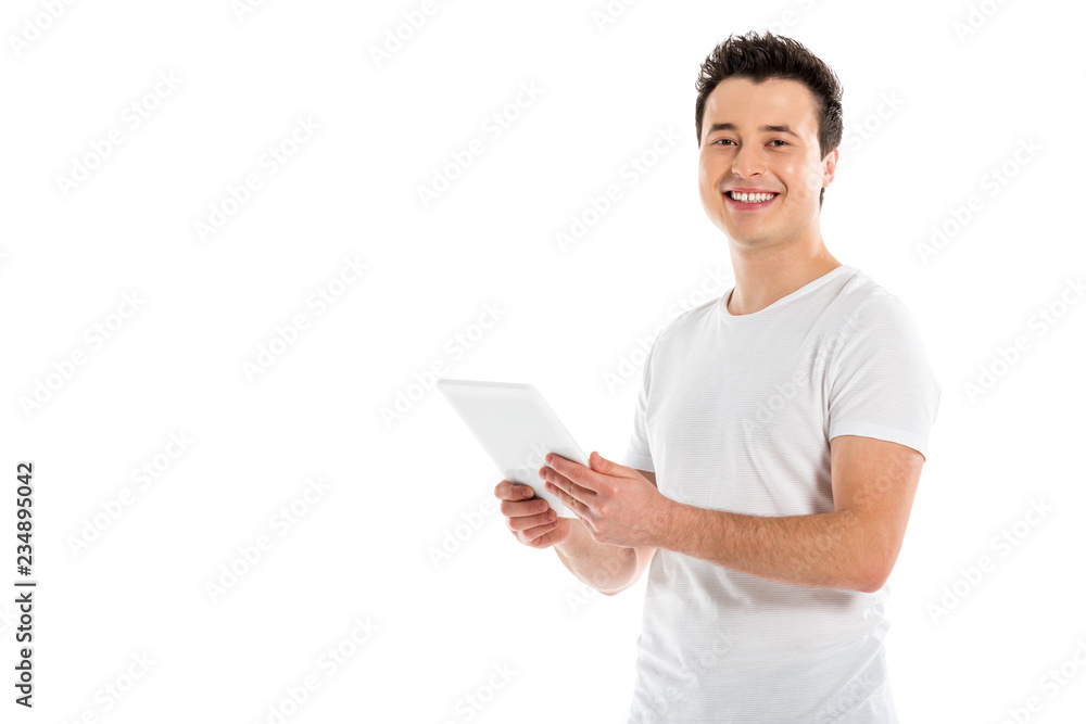 handsome man using digital tablet and looking at camera isolated on white handsome man using digital tablet and looking at camera isolated on white