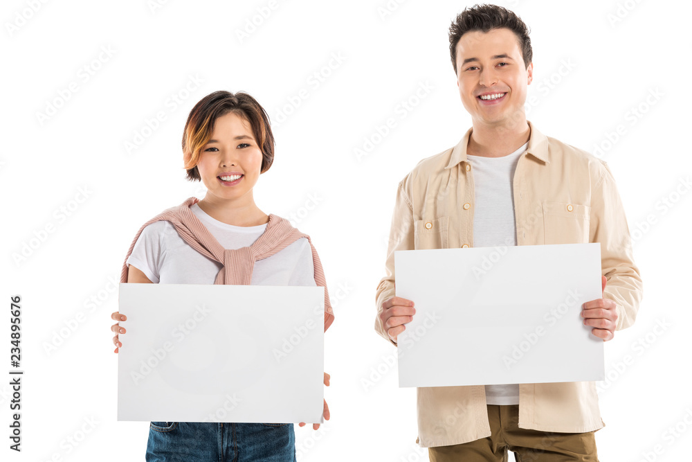 smiling husband and wife in casual clothes looking at camera and holding two blank boards isolated on white smiling husband and wife in casual clothes looking at camera and holding two blank boards isolated on white