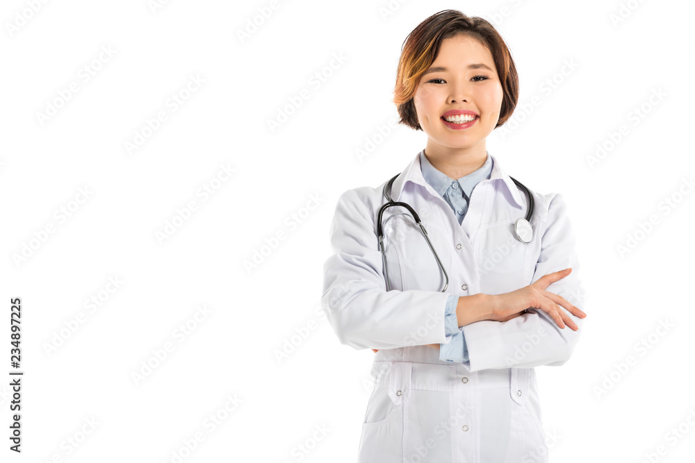 smiling female doctor with stethoscope and arms crosses looking at camera isolated on white smiling female doctor with stethoscope and arms crosses looking at camera isolated on white