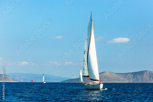 Sailing luxury boats during yacht regatta in Aegean Sea at Greece.