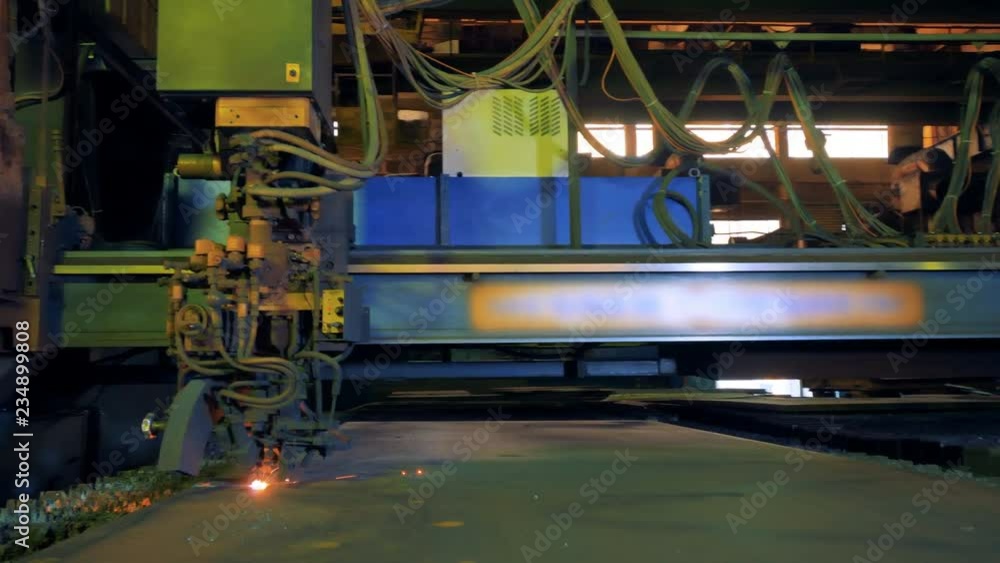 Automated welding machine at a factory, close up. Automated welding machine at a factory, close up.