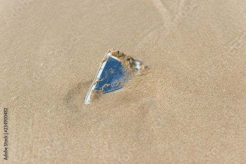 Mobile phone floated to the sea at the beach concept water damage