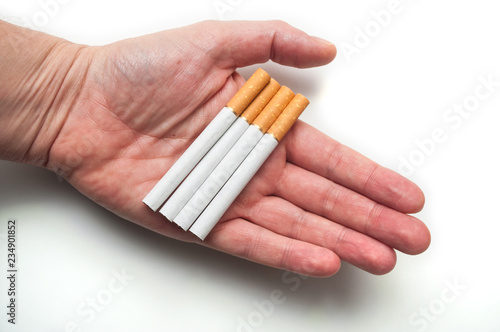 closeup of cigarettes in hand on white background