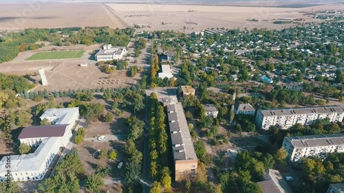 Aerial shot of Askania- Nova with its huge fields, houses, and parks in summer photo