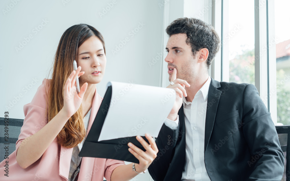 Business people having fun and chatting at workplace office.Collaboration and analysis by business people working in office. Business people having fun and chatting at workplace office.Collaboration and analysis by business people working in office.