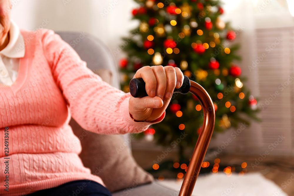 Elderly Woman Sitting Near Christmas Tree Stock Photo 1245796264