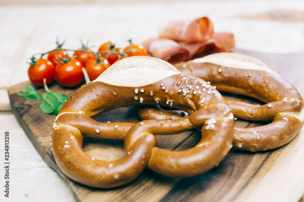 Pretzel concept on bright wooden table Pretzel concept on bright wooden table