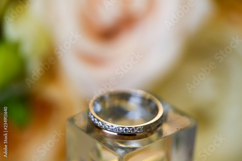 Close up with beautiful bouquet of flowers and rings