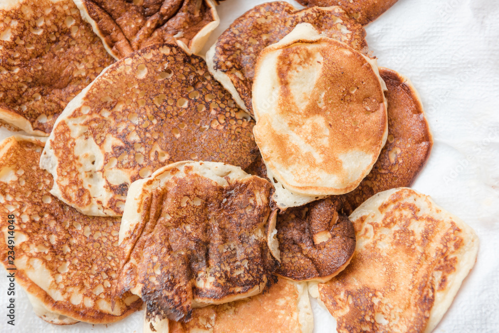 Ready pancakes on a plate. Rosy fresh and tasty pastries. Ready breakfast on a plate.