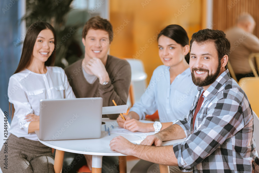 Skillful four colleagues examining market