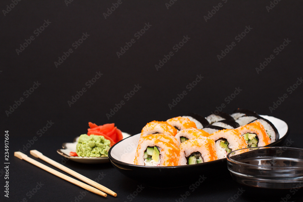 Uramaki California. Sushi rolls and plate with red pickled ginger and wasabi. Uramaki California. Sushi rolls and plate with red pickled ginger and wasabi.